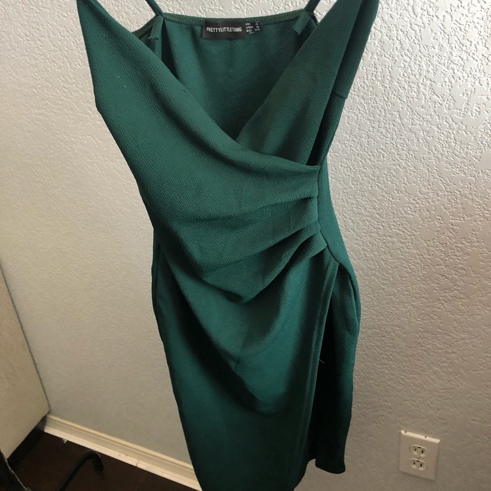 An olive green tight slit dress
